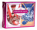 A vibrant and artistic box set of Bridge playing cards by Eeboo, featuring beautiful illustrations of colorful birds in red and blue tones, with floral designs. The packaging is elegantly pink and showcases the title 'Bridge Set' prominently.