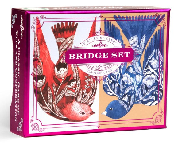 A vibrant and artistic box set of Bridge playing cards by Eeboo, featuring beautiful illustrations of colorful birds in red and blue tones, with floral designs. The packaging is elegantly pink and showcases the title 'Bridge Set' prominently.