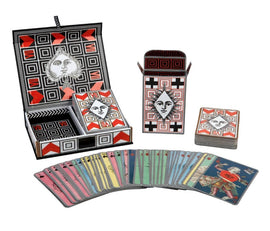 A stylish set of Christian Lacroix Playing Cards known as Poker Face, presented in a decorative box. The set includes a deck of colorful cards featuring unique designs with vivid patterns, complemented by an elegant card holder and a separate storage box, all designed with a modern artistic flair.