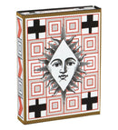 Elegant box of Christian Lacroix Playing Cards featuring a striking design with a sun motif surrounded by geometric patterns in red and black. Perfect for a stylish game night.