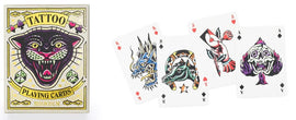 Tattoo Playing Cards box featuring a colorful panther design. Four playing cards displayed, showcasing unique tattoo-inspired artwork including a dragon, a horse, and a skull.