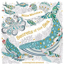 Cover of 'Millie Marotta's Secrets of the Sea', an intricate coloring book featuring a variety of sea creatures such as a whale, octopus, and colorful fish, adorned with artistic designs and patterns in vibrant colors.