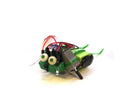 The Varikabi Robotic Critter is a DIY kit designed as a dark green frog. It features large expressive eyes and various colorful wires and components that showcase its robotic nature. Ideal for hands-on learning, this robotic kit combines creativity and engineering, perfect for kids and DIY enthusiasts alike.