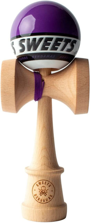 The Starter Purple Kendama by Sweets Kendamas features a vibrant purple ball integrated with a sturdy wooden base. The premium craftsmanship is evident in the detailed grain of the wood and the sleek design of the kendama, which is perfect for both beginners and seasoned players looking to enhance their skills. The string attachment ensures a secure and playful experience, making it a popular choice for kendama enthusiasts.