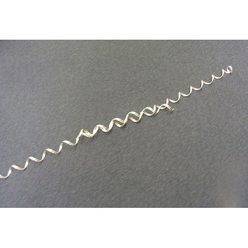 Magic Wire by Leonard G. Styche & Asso laid out on a dark background. The product is a flexible, wavy wire that can be manipulated into various shapes and figures, encouraging creativity and fine motor skills. It's a fun and engaging tool for DIY projects or as a fidget toy.