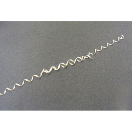 Magic Wire by Leonard G. Styche & Asso laid out on a dark background. The product is a flexible, wavy wire that can be manipulated into various shapes and figures, encouraging creativity and fine motor skills. It's a fun and engaging tool for DIY projects or as a fidget toy.