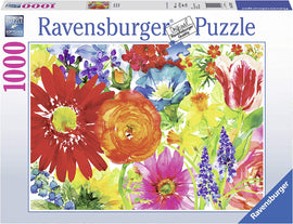 A colorful jigsaw puzzle box for the Ravensburger Abundant Blooms 1000 piece puzzle, featuring a vibrant floral design with various flowers like gerberas, tulips, and other blossoms in warm hues. The box displays the premium quality and soft-click technology of Ravensburger puzzles, ideal for puzzle enthusiasts.