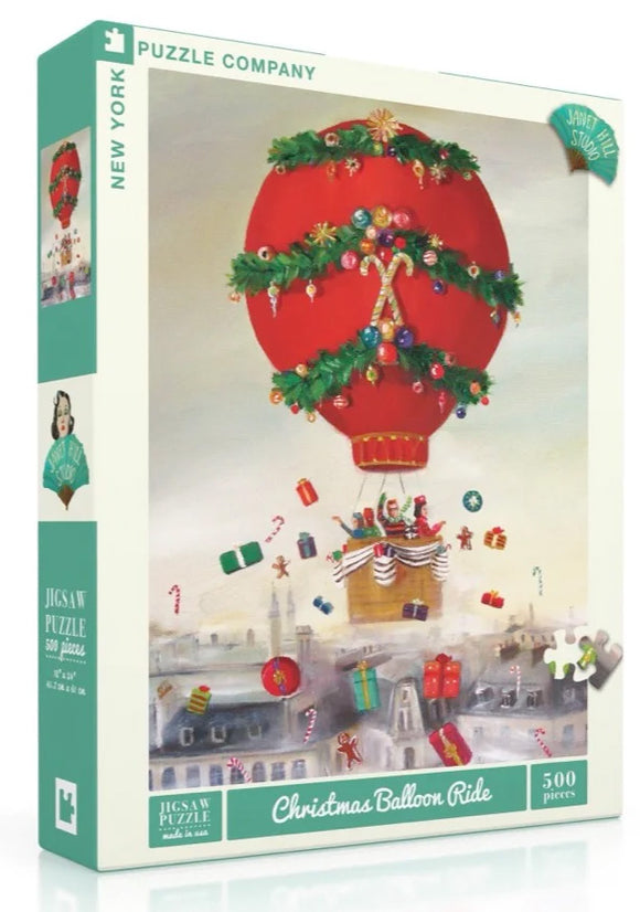 The Christmas Balloon Ride Puzzle by New York Puzzle Company features a whimsical illustration of a hot air balloon decorated for the holiday season. The vibrant red balloon is adorned with festive greenery and ornaments, floating above a snowy town filled with colorful gifts, candy canes, and cheerful characters. This 500-piece jigsaw puzzle captures the joy and magic of Christmas, making it a delightful activity for families and puzzle enthusiasts alike.