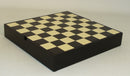 A 13.25-inch chess board featuring a black and maple design, showcasing alternating squares. The board is compact and designed for storage, ideal for chess enthusiasts.
