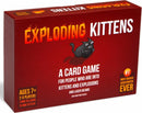 Exploding Kittens card game box featuring a cartoon cat in a playful design. The box highlights the game is for ages 7 and up, designed for 2-5 players, and takes 2 minutes to learn and 15 minutes to play. It boasts the '#1 MOST-BACKED KICKSTARTER EVER' label.