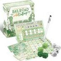 Railroad Ink: Lush Green game by Horrible Guild featuring a vibrant green-themed box. The box is open, showcasing game components including a mini board, green dice, and a pen for gameplay. The board has a grid layout designed for creating transport routes in a lush, nature-inspired setting.