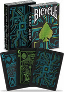 A deck of Bicycle Dark Mode playing cards featuring a sleek, tech-inspired design with vibrant green and blue circuit patterns. The black card faces highlight unique illustrations for the King of Spades and other cards, presented in an eye-catching tuck box that showcases the modern style.
