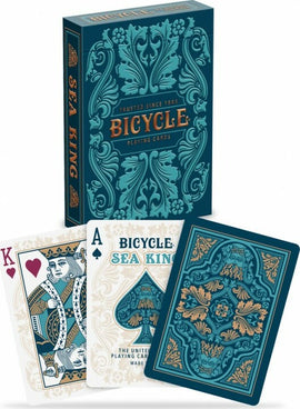 Bicycle Sea King playing cards set, featuring a beautifully designed box with ornate teal and gold patterns. The King of Hearts and Ace of Spades cards are displayed, showcasing detailed illustrations and the Bicycle logo.