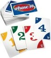 A colorful deck of Phase 10 cards by Mattel, featuring the game title prominently on the top card. The cards display numbers and colors, highlighting the gameplay elements. Perfect for family game nights and friends gatherings.