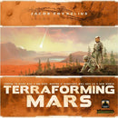 Cover of the game 'Terraforming Mars' by Stronghold Games. The artwork features two astronauts in a Martian landscape, with one planting vegetation. A comet streaks through the orange sky, signifying exploration and innovation in colonizing Mars.