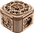 A beautifully crafted UGears 3D Treasure Box DIY kit made of natural wood. The box features intricate laser-cut designs and an elegant, vintage aesthetic. It is a mesmerizing piece that combines art with mechanical engineering, showcasing precision craftsmanship. Ideal for collectors and DIY enthusiasts, this mechanical puzzle serves both as a decorative item and a functional treasure box.