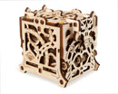 The UGears 3D Dice Keeper is a beautifully crafted wooden DIY kit designed to store dice. Its intricate laser-cut patterns showcase a combination of functional and aesthetic features, perfect for board game enthusiasts. The cube-shaped design has various cut-out shapes and details, highlighting expert craftsmanship and creativity.