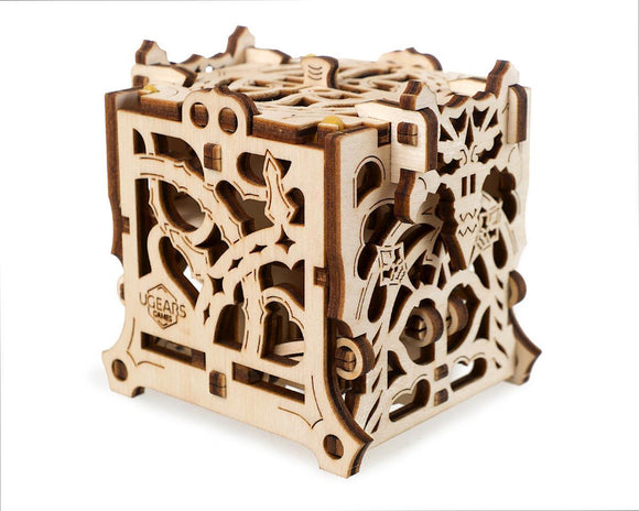 The UGears 3D Dice Keeper is a beautifully crafted wooden DIY kit designed to store dice. Its intricate laser-cut patterns showcase a combination of functional and aesthetic features, perfect for board game enthusiasts. The cube-shaped design has various cut-out shapes and details, highlighting expert craftsmanship and creativity.