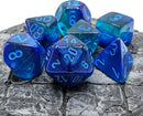 A collection of vibrant blue and light blue polyhedral dice by Chessex. The dice feature luminous sparkles and clear markings, set against a textured gray background.