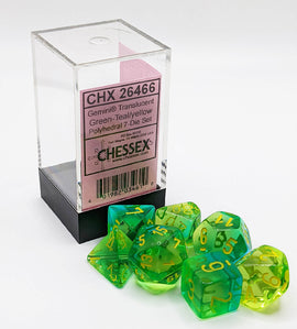 Gemini Translucent Green, Teal, and Yellow Polyhedral 7-Die Set by Chessex. The set includes seven vibrant dice in various shapes, featuring clear numbers on a vivid color gradient. The dice are displayed next to their packaging, which is in a clear plastic box with a pink label. Ideal for tabletop gaming enthusiasts.