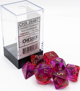 A set of seven translucent polyhedral dice in red-violet and gold colors, displayed in a clear container with a black base. The dice feature gold numbers and are arranged around the box, showcasing their vibrant hues and shapes, ideal for tabletop games.
