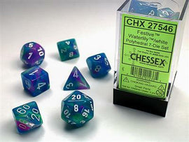 A colorful set of Festive Waterlily white polyhedral dice by Chessex. The set includes seven diverse dice, showcasing vibrant blue, purple, and white colors with clear numbers. The packaging is transparent, highlighting the dice inside, with a prominent label stating 'CHX 27546' and the Chessex logo.