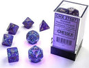 Chessex Borealis Luminary Royal Purple and Gold Polyhedral Dice Set featuring seven beautifully crafted dice with sparkly royal purple and gold colors. The set is displayed in a clear box, showcasing each die: a d20, d12, d10, d8, d6, and d4, all adorned with intricate gold numbers for easy visibility and play.