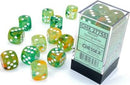 A collection of Nebula Spring/White Lumin 12-sided dice in various shades of green, orange, and white, spread out around a clear packaging box labeled 'Chessex'. The dice feature vibrant swirls and white dots, making them visually striking for gaming enthusiasts.