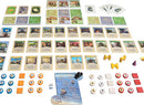 An overhead view of the Catan: Cities & Knights board game, showcasing the various game components including resource cards, building development cards, player pieces, and a modular board set up for gameplay.