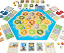 Catan: Cities & Knights board game featuring a hexagonal game board with various resource tiles, player pieces in different colors, and development cards. The layout includes numbered tiles, roads, settlements, and cities. Accessories such as dice and tokens are also visible around the board, suggesting a strategic gameplay experience.
