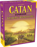 Catan: Traders & Barbarians board game box featuring vibrant artwork. The box displays scenes of traders and barbarians in a scenic landscape, highlighting the game's theme of trade and adventure. The title is prominently featured in bold, yellow text against a purple background.