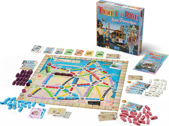 Ticket to Ride: San Francisco board game by Days of Wonder. The image shows a colorful game board featuring various routes and locations in San Francisco, along with player pieces, cards, and the game box. Elements include train tokens in multiple colors, destination cards, and a scenic depiction of the Golden Gate Bridge.