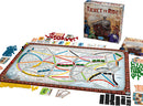 Ticket to Ride board game by Days of Wonder featuring a colorful game board with train routes across a map, player pieces in various colors, train cards, and ticket cards spread around the board. The box showcases vibrant artwork depicting a steam train and characters.