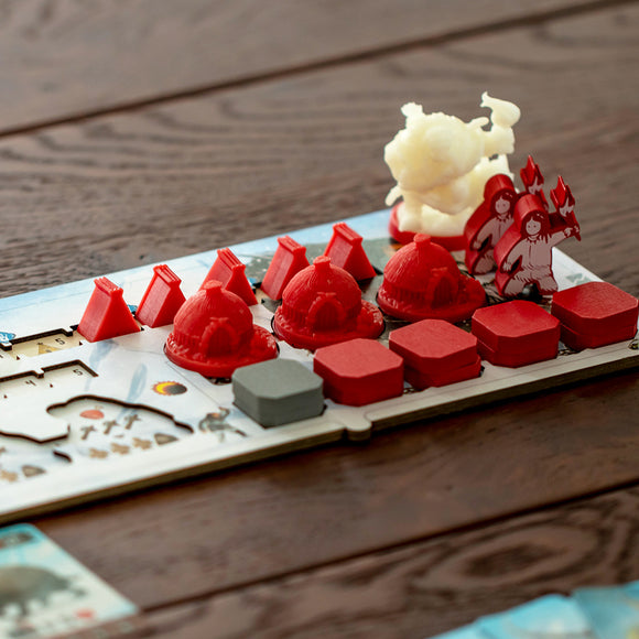 Endless Winter Paleoamericans game by Fantasia Games featuring colorful game pieces including red domes, gray blocks, and figures representing characters engaged in a frosty landscape. The game board showcases an Arctic setting with intricate designs promoting strategy and teamwork.
