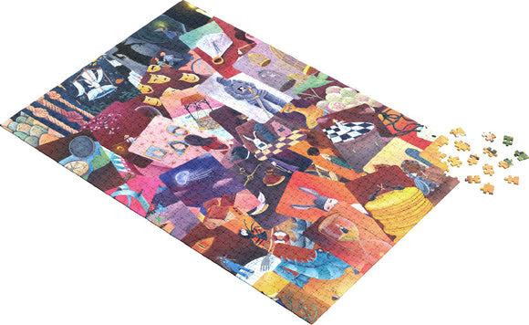 A vibrant jigsaw puzzle titled 'Red MishMash' by Asmodee, featuring a colorful collage of artistic illustrations and designs. The puzzle is partially assembled, with several pieces scattered around it. Each section showcases unique colors and themes, creating an engaging visual experience.