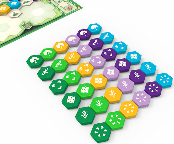 Close-up view of 'Azul: Queen's Garden' game pieces featuring colorful hexagonal tiles in various shades, each displaying intricate floral and garden designs. The game board is partially visible in the background, enhancing the vibrant theme of garden design.