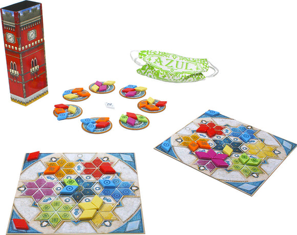 The Azul: Summer Pavilion game by NEXT MOVE GAMES features vibrant, colorful tiles arranged on two game boards. A tall decorative box contains the game components, including players' boards and round trays with various tessellating tiles in shades of blue, yellow, red, and green. A green mask with 'AZUL' is included, adding a playful element to the set.