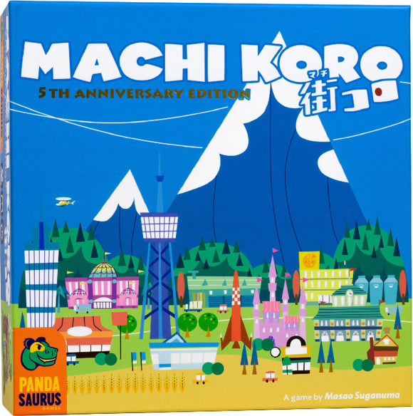 Machi Koro 5th Anniversary Edition game box featuring a colorful and whimsical cityscape with buildings, mountains, and a blue sky. The box design includes a variety of illustrations such as amusement structures and landmarks, representing the vibrant gameplay of city building and strategy.
