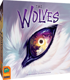 The Wolves game box featuring a striking illustration of a wolf's eye with vivid colors and a scene of wolves and nature reflected in the pupil. The design captures the mysterious and wild essence of wolves, emphasizing intrigue and adventure. The game is made by PANDASAURUS GAMES and is suitable for both family and friends.