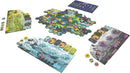 The Wolves game by PANDASAURUS GAMES displayed across a table. The game features colorful hexagonal tiles representing different terrains, player boards, and various tokens and pawns in purple and yellow. The vibrant layout indicates a strategy-based gameplay with wolf-themed elements, suitable for both family and adult gamers.
