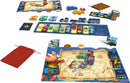 Orichalcum game by PANDASAURUS GAMES displayed on a table. The game includes colorful player pieces, coins, cards, and a detailed game board featuring a map design and character illustrations, all arranged for gameplay.