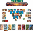 A strategic board game setup of '7 Wonders Duel' by Asmodee, featuring a colorful arrangement of cards and tokens. The game board showcases two player areas with resource cards, civilization cards, and a score track, set against a vibrant background depicting ancient wonders.