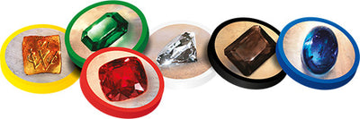 A vibrant display of various polished gemstone tokens used in the Splendor board game. The tokens include a yellow, green, red, black, blue, and clear gem, each encircled by a colored base, showcasing the game's emphasis on collecting and building a prosperous gem empire.