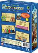 Carcassonne: Expansion 1 – Inns & Cathedrals game box by Z-Man Games. The box features vibrant artwork, includes 72 land tiles, 8 meeples, and highlights gameplay mechanics for 2-6 players. It emphasizes adding inns and cathedrals to enhance scoring opportunities in the Carcassonne board game.