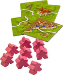 Carcassonne: Expansion 1 – Inns & Cathedrals game components including vibrant green terrain tiles depicting buildings and roads, alongside ten pink meeple pieces. Perfect for enhancing the strategy of the classic Carcassonne game.
