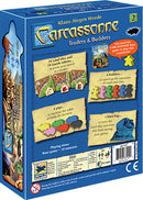 Carcassonne: Expansion 2 – Traders & Builders game box featuring colorful artwork and components. The back of the box displays information about the game, including the number of land tiles, goods tokens, and gameplay mechanics. Intricate designs and illustrations highlight the theme of trade and building in the popular Carcassonne board game series.