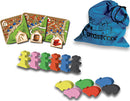 Carcassonne: Expansion 2 – Traders & Builders game components including colorful meeples, pig tokens, and expansion tiles with artistic illustrations. Also features a blue drawstring bag with the Carcassonne logo.