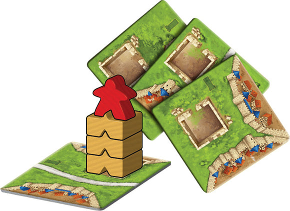 Carcassonne: Expansion 4 – The Tower board game components displayed, featuring greenery game tiles and a tower with red and yellow meeples. Ideal for strategy lovers.