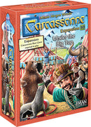 Carcassonne: Expansion 10 – Under the Big Top box, featuring colorful circus scenes with characters, elephants, and bear. A vibrant addition to the Carcassonne board game series by Z-Man Games, it enhances gameplay with new mechanics and themes. The box is adorned with whimsical artwork and a prominent logo.