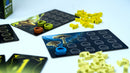 Wonder Woods game by Blue Orange U.S.A. featuring colorful game pieces including orange, green, and yellow tokens, spread across illustrated game boards with intricate designs of mushrooms and textures. The layout shows a mix of strategy and exploration elements suitable for family game nights and creative gameplay.